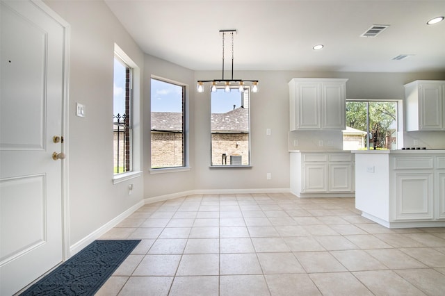 7147 Hot Creek Trce, Humble, TX 77346 - unfurnished dining area featuring light tile patterned floors and recessed lighting