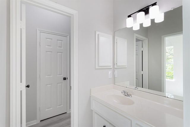 7147 Hot Creek Trce, Humble, TX 77346 - bathroom featuring vanity and wood finished floors