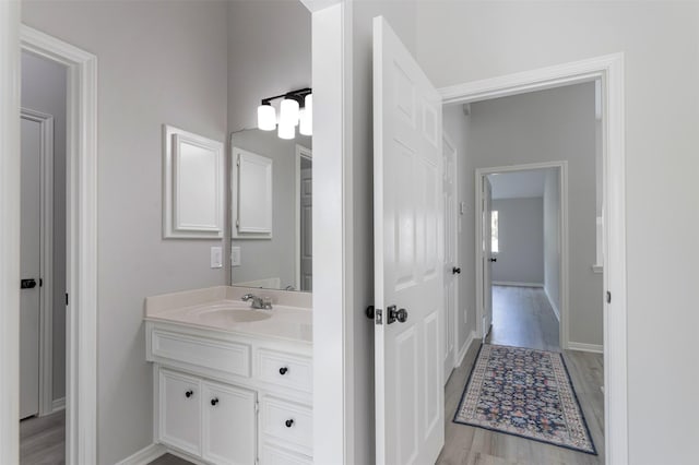 7147 Hot Creek Trce, Humble, TX 77346 - bathroom with vanity and wood finished floors