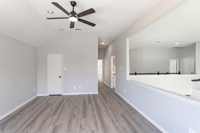 7147 Hot Creek Trce, Humble, TX 77346 - unfurnished living room with wood finished floors, ceiling fan, vaulted ceiling, and recessed lighting