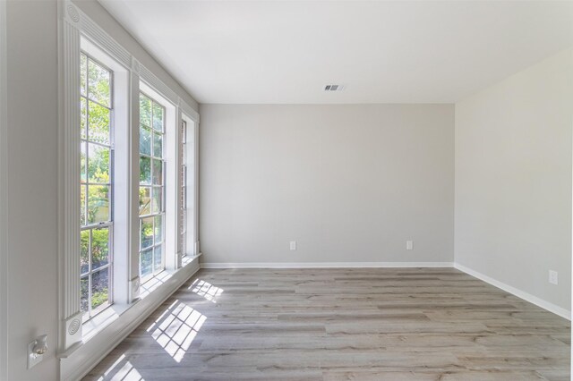 7147 Hot Creek Trce, Humble, TX 77346 - spare room with light wood-style flooring and baseboards