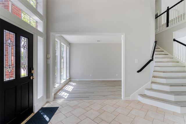 7147 Hot Creek Trce, Humble, TX 77346 - tiled foyer with a towering ceiling and stairs