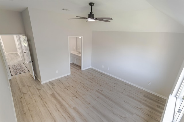 7147 Hot Creek Trce, Humble, TX 77346 - empty room with ceiling fan, light wood-type flooring, and vaulted ceiling