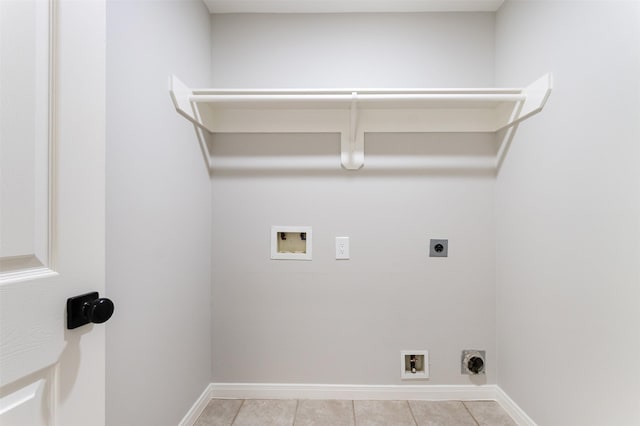7147 Hot Creek Trce, Humble, TX 77346 - washroom with hookup for an electric dryer, hookup for a washing machine, and light tile patterned flooring