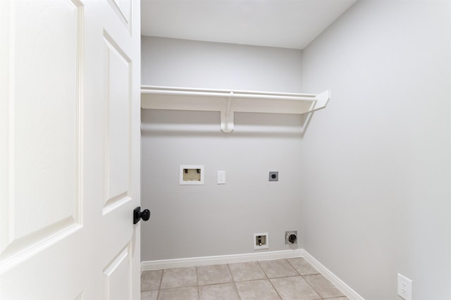 7147 Hot Creek Trce, Humble, TX 77346 - washroom with electric dryer hookup, hookup for a washing machine, and light tile patterned floors