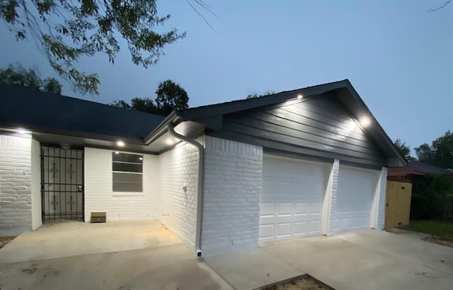 11319 Lockgate Ln, Houston, TX 77048 - view of property exterior with brick siding and a garage