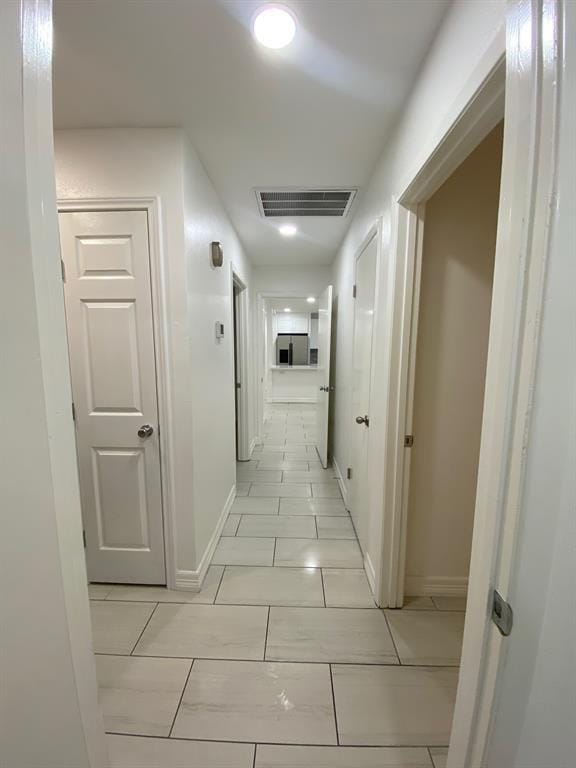 11319 Lockgate Ln, Houston, TX 77048 - hall featuring baseboards and light tile patterned flooring