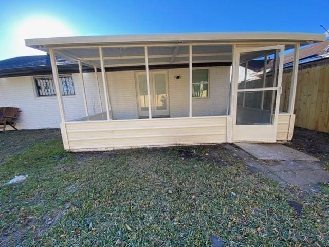 11319 Lockgate Ln, Houston, TX 77048 - rear view of property with a sunroom