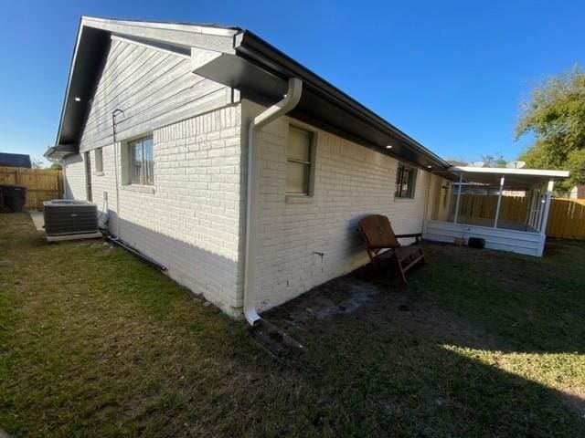 11319 Lockgate Ln, Houston, TX 77048 - view of home's exterior featuring brick siding and a sunroom