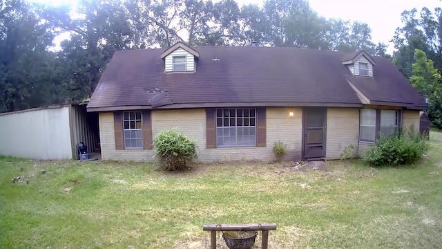 4723 Springfield Ln, Brenham, TX 77833 - new england style home featuring brick siding and a front yard