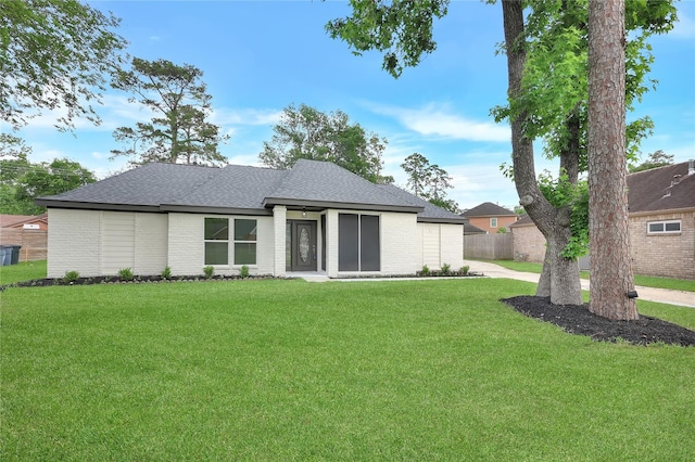 1503 Bamwick Dr, Houston, TX 77090 - rear view of property featuring roof with shingles and brick siding