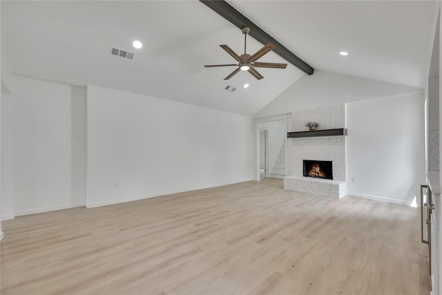 1503 Bamwick Dr, Houston, TX 77090 - unfurnished living room with beam ceiling, a ceiling fan, a fireplace, light wood-style flooring, and recessed lighting