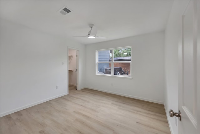 1503 Bamwick Dr, Houston, TX 77090 - unfurnished bedroom with light wood-type flooring, a walk in closet, ceiling fan, and a closet