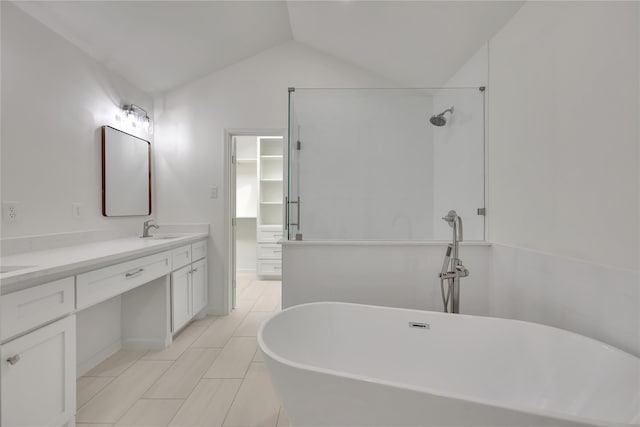 1503 Bamwick Dr, Houston, TX 77090 - bathroom featuring double vanity, a freestanding bath, vaulted ceiling, tile patterned flooring, and a shower