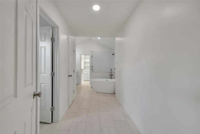 1503 Bamwick Dr, Houston, TX 77090 - hall with recessed lighting, light tile patterned floors, and vaulted ceiling