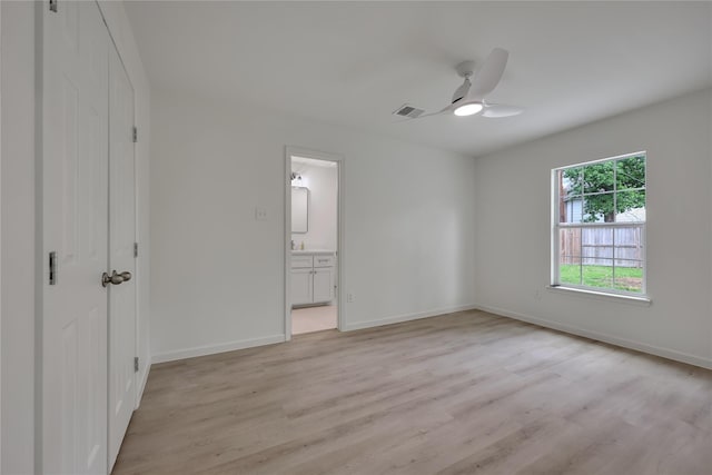 1503 Bamwick Dr, Houston, TX 77090 - unfurnished bedroom featuring light wood finished floors, ensuite bathroom, and ceiling fan