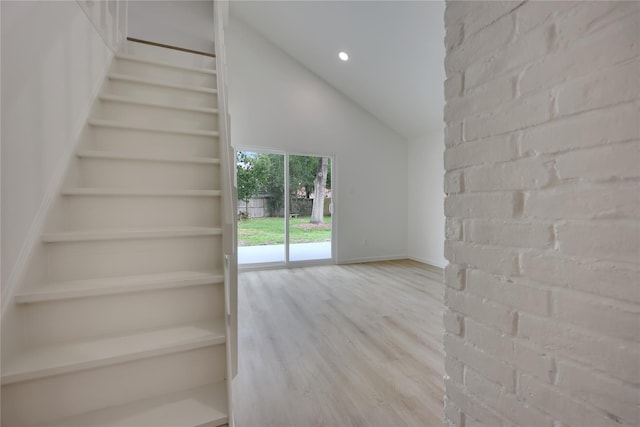 1503 Bamwick Dr, Houston, TX 77090 - stairway with wood finished floors, vaulted ceiling, and recessed lighting