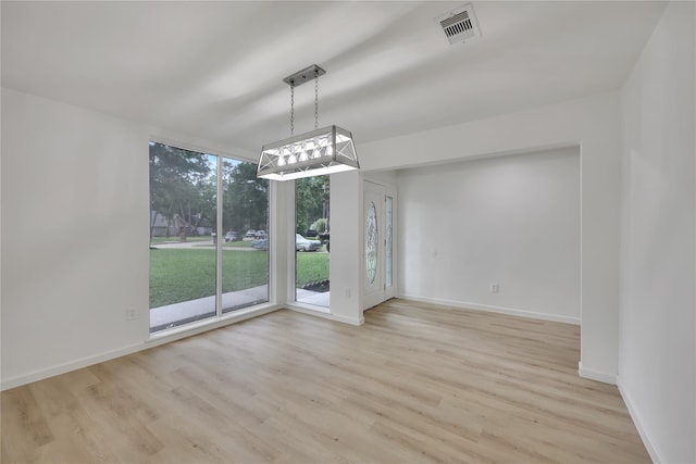 1503 Bamwick Dr, Houston, TX 77090 - unfurnished dining area with light wood-style floors and baseboards