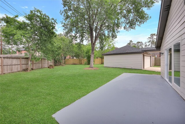 1503 Bamwick Dr, Houston, TX 77090 - fenced backyard with a patio area and an outbuilding