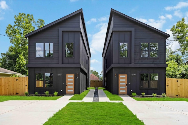 2407 Dolly Wright St, Houston, TX 77088 - contemporary home with board and batten siding and a gate