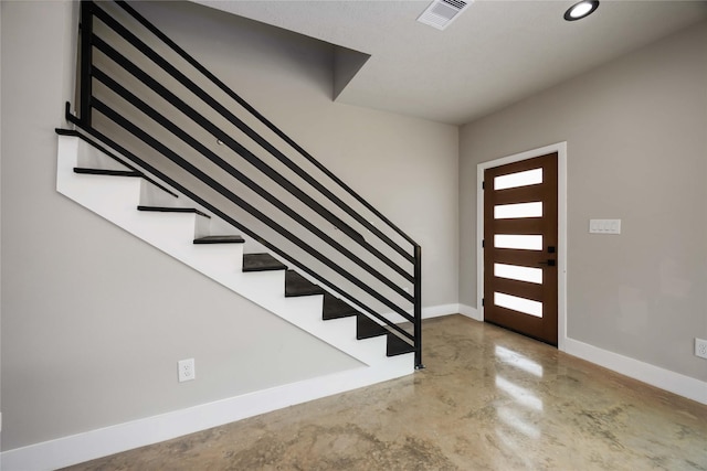 2407 Dolly Wright St, Houston, TX 77088 - entryway featuring stairway, finished concrete flooring, and recessed lighting