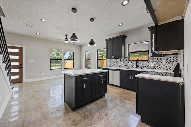 2407 Dolly Wright St, Houston, TX 77088 - kitchen featuring stainless steel dishwasher, dark cabinets, ceiling fan, backsplash, and finished concrete floors
