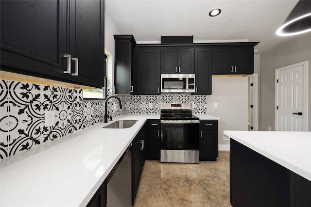 2407 Dolly Wright St, Houston, TX 77088 - kitchen with appliances with stainless steel finishes, dark cabinets, and decorative backsplash