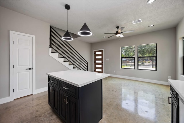 2407 Dolly Wright St, Houston, TX 77088 - kitchen featuring dark cabinets, concrete floors, light countertops, ceiling fan, and recessed lighting