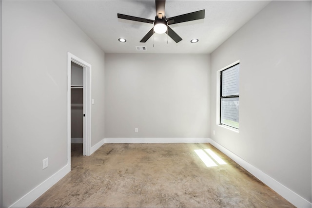 2407 Dolly Wright St, Houston, TX 77088 - unfurnished bedroom with concrete floors, recessed lighting, a walk in closet, and ceiling fan