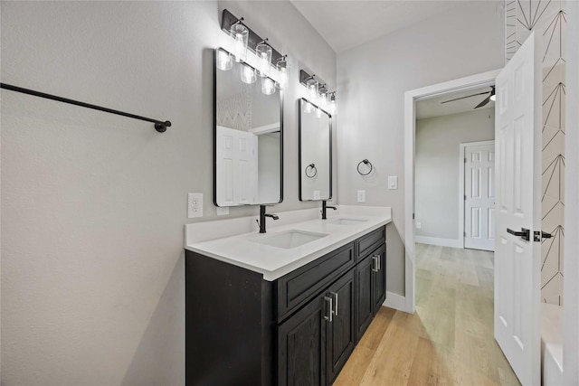 2407 Dolly Wright St, Houston, TX 77088 - bathroom with wood finished floors, double vanity, and ceiling fan