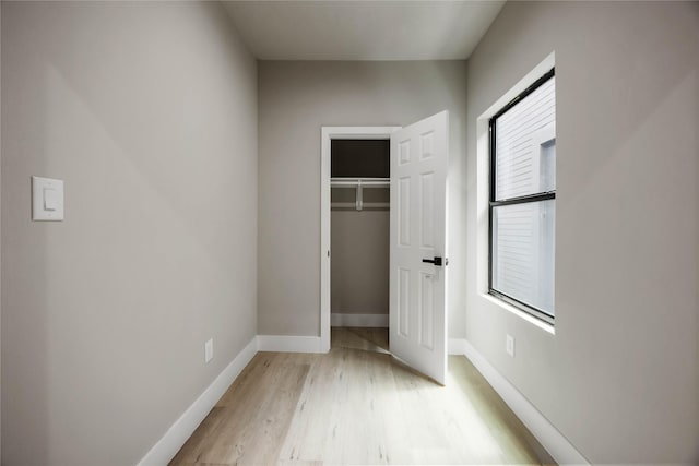 2407 Dolly Wright St, Houston, TX 77088 - unfurnished bedroom featuring light wood-type flooring and a closet