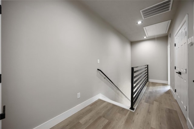 2407 Dolly Wright St, Houston, TX 77088 - hallway with an upstairs landing, attic access, light wood finished floors, and recessed lighting
