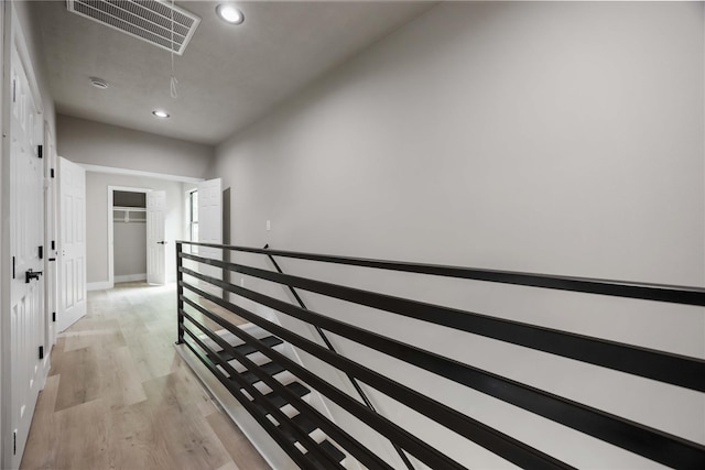 2407 Dolly Wright St, Houston, TX 77088 - hallway with attic access, an upstairs landing, light wood-style flooring, and recessed lighting