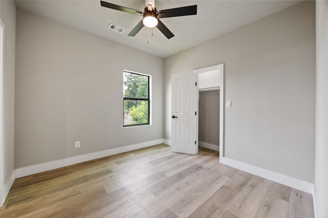 2407 Dolly Wright St, Houston, TX 77088 - unfurnished bedroom featuring light wood finished floors and ceiling fan