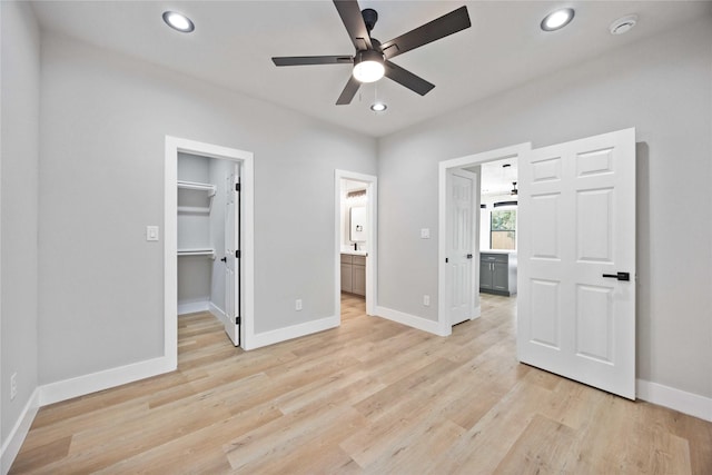 2409 Dolly Wright St, Houston, TX 77088 - unfurnished bedroom with a walk in closet, recessed lighting, light wood-style flooring, ensuite bathroom, and a closet