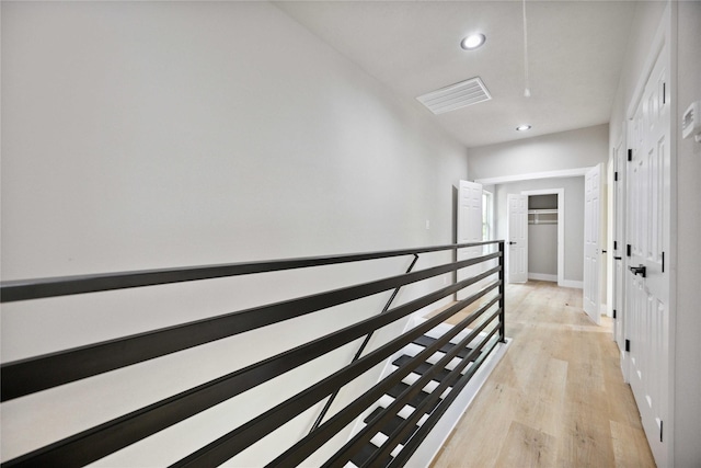 2409 Dolly Wright St, Houston, TX 77088 - hall with an upstairs landing, light wood-style flooring, and recessed lighting