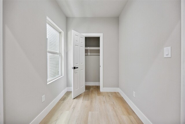 2409 Dolly Wright St, Houston, TX 77088 - unfurnished bedroom featuring light wood finished floors and a closet
