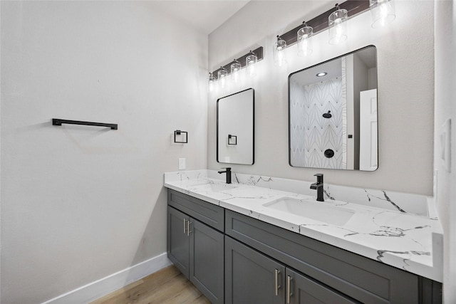2409 Dolly Wright St, Houston, TX 77088 - bathroom featuring double vanity and wood finished floors