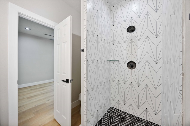 2409 Dolly Wright St, Houston, TX 77088 - bathroom with tiled shower and wood finished floors