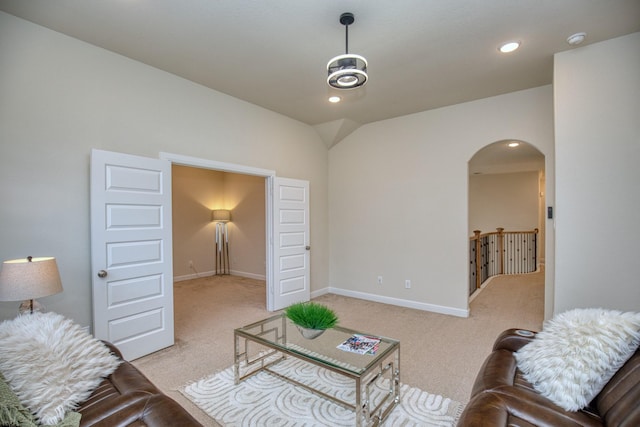 5506 Bellingen River Ln, Sugar Land, TX 77479 - living area with arched walkways, light colored carpet, recessed lighting, and vaulted ceiling