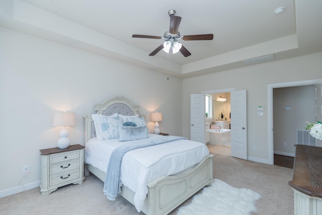 5506 Bellingen River Ln, Sugar Land, TX 77479 - bedroom with light colored carpet, a tray ceiling, ensuite bathroom, and ceiling fan