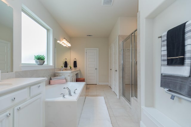 5506 Bellingen River Ln, Sugar Land, TX 77479 - full bathroom featuring vanity, a shower stall, a bath, and tile patterned floors