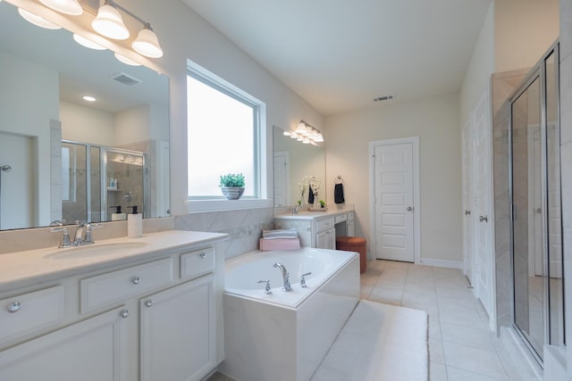5506 Bellingen River Ln, Sugar Land, TX 77479 - full bathroom with a stall shower, two vanities, a bath, and tile patterned floors