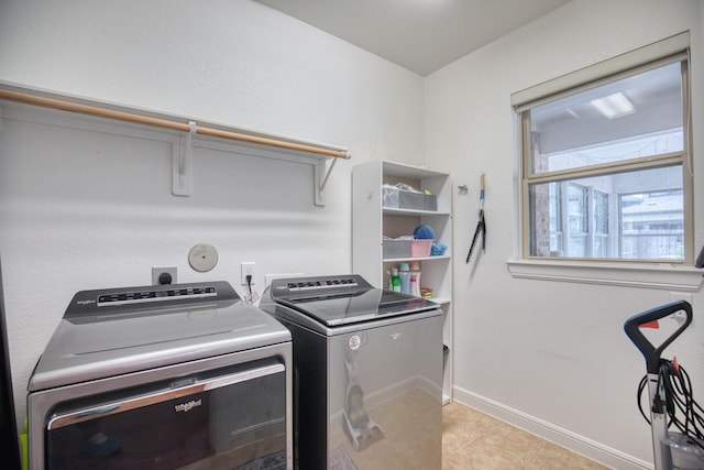 5506 Bellingen River Ln, Sugar Land, TX 77479 - laundry room with washing machine and dryer and light tile patterned flooring
