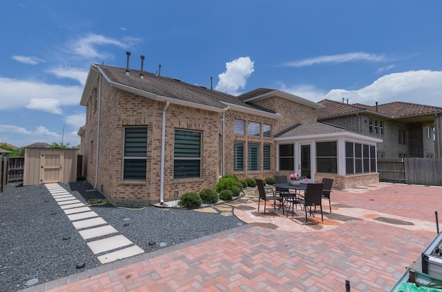 5506 Bellingen River Ln, Sugar Land, TX 77479 - back of house with a patio, a fenced backyard, brick siding, and a shed