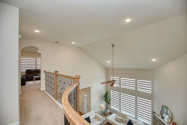 5506 Bellingen River Ln, Sugar Land, TX 77479 - hallway with arched walkways, healthy amount of natural light, carpet floors, recessed lighting, and vaulted ceiling