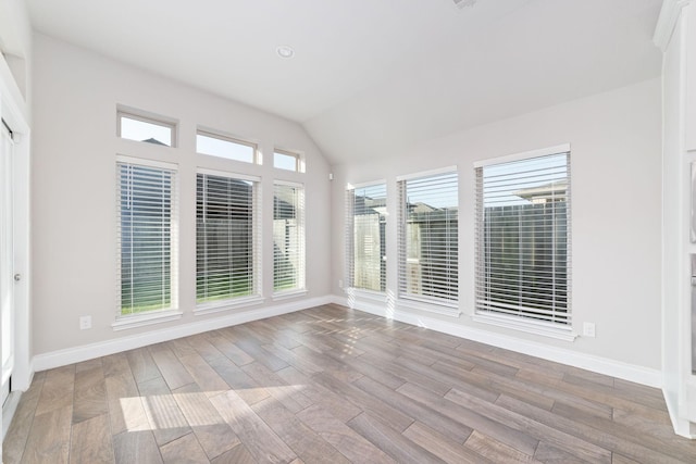 13727 Pedernales Ct, Cypress, TX 77429 - unfurnished sunroom featuring wood finished floors and vaulted ceiling