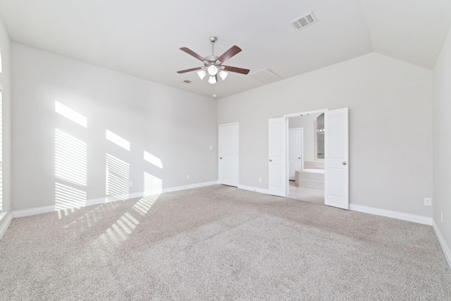 13727 Pedernales Ct, Cypress, TX 77429 - unfurnished bedroom featuring carpet, connected bathroom, a ceiling fan, and lofted ceiling