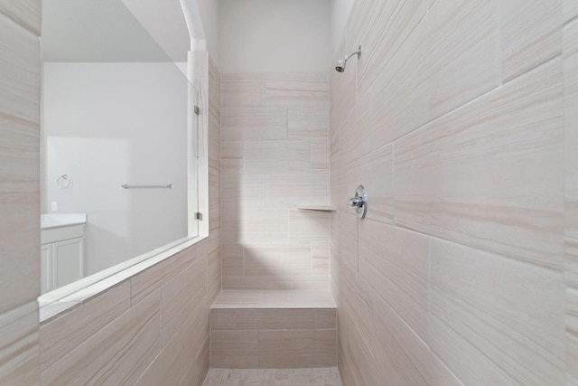 13727 Pedernales Ct, Cypress, TX 77429 - bathroom featuring a tile shower and vanity