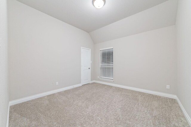13727 Pedernales Ct, Cypress, TX 77429 - carpeted spare room featuring baseboards and lofted ceiling